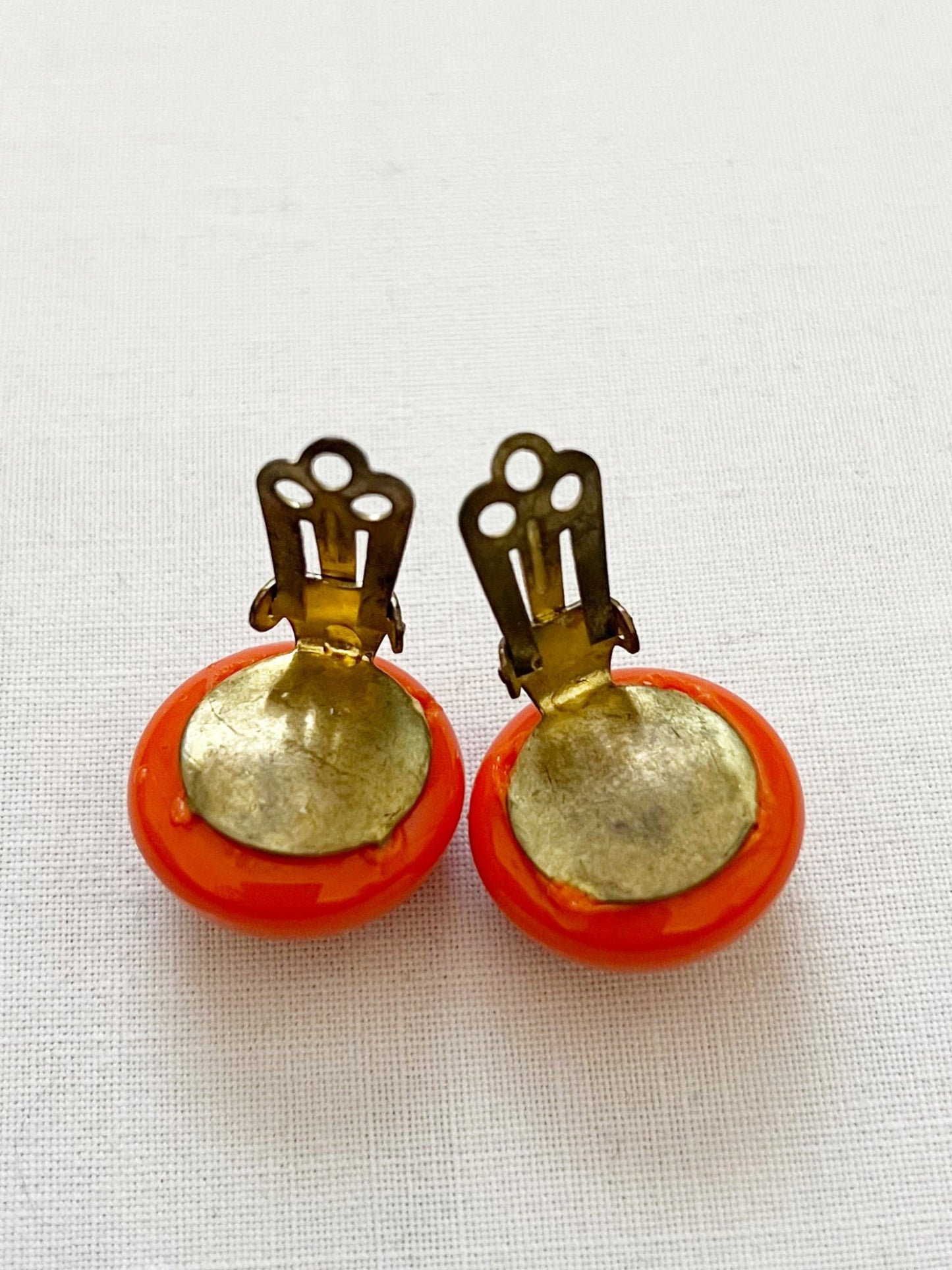 Orange clip-on earrings