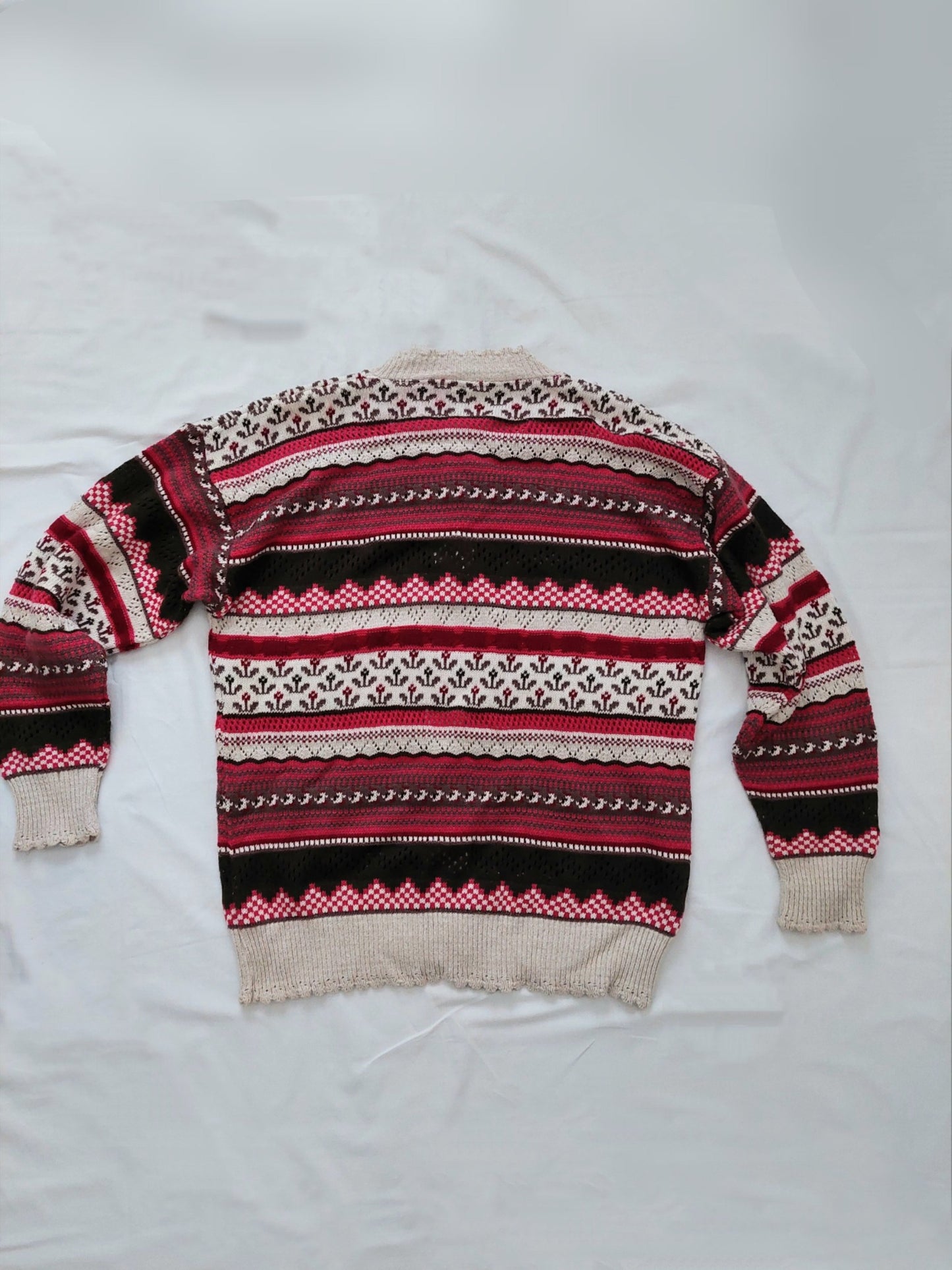 The back of the multicoloured knitted cardigan