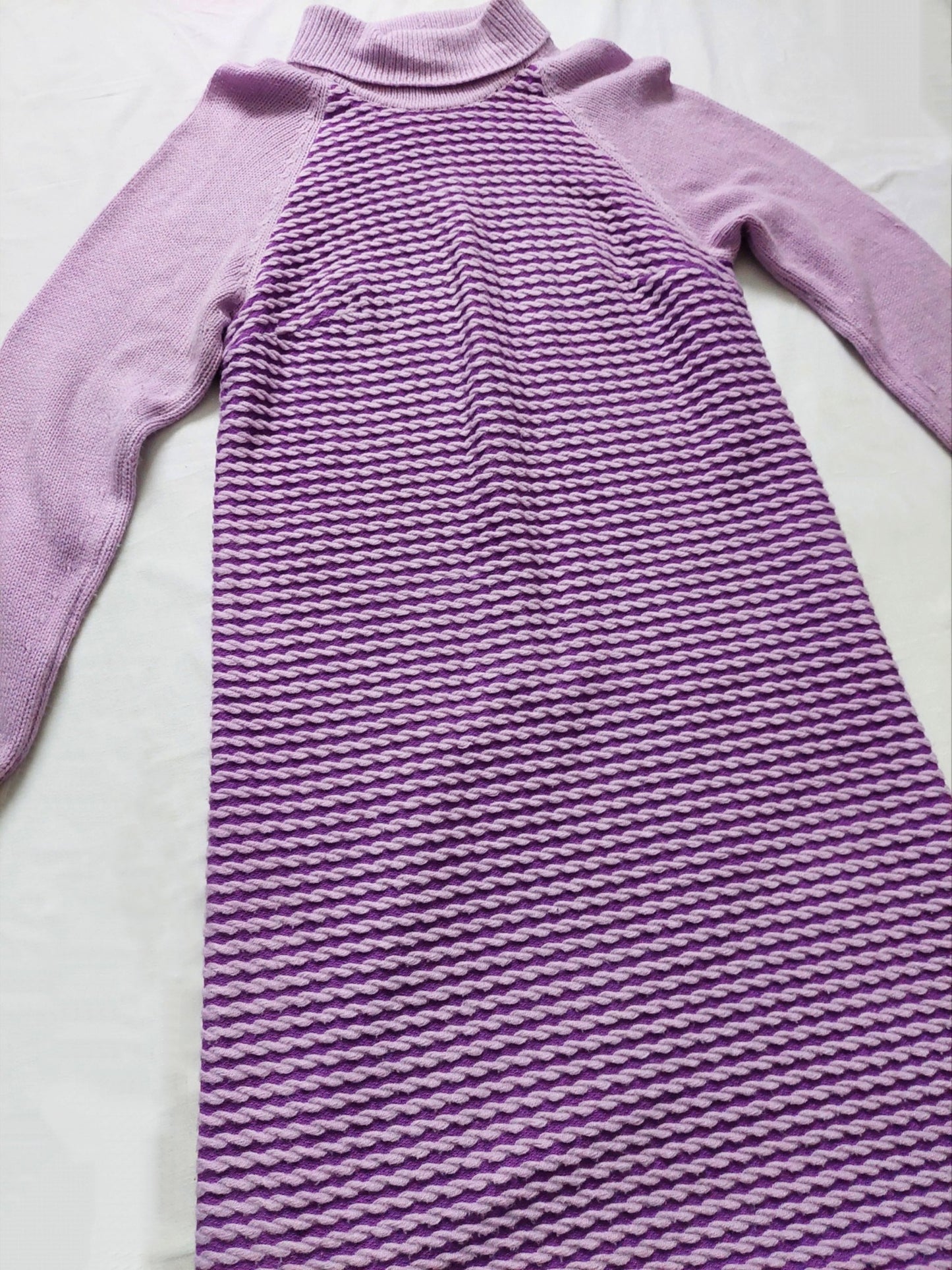 A close up of the purple midi dress