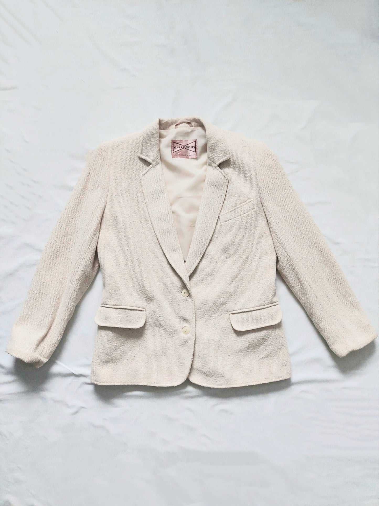 A vintage white dixi coat suit