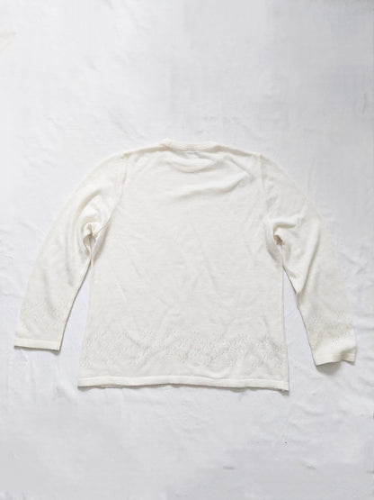 The back of the white sweater