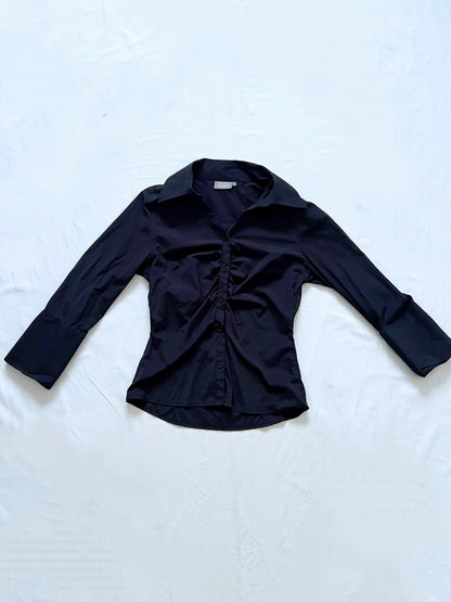 A vintage black ruched shirt