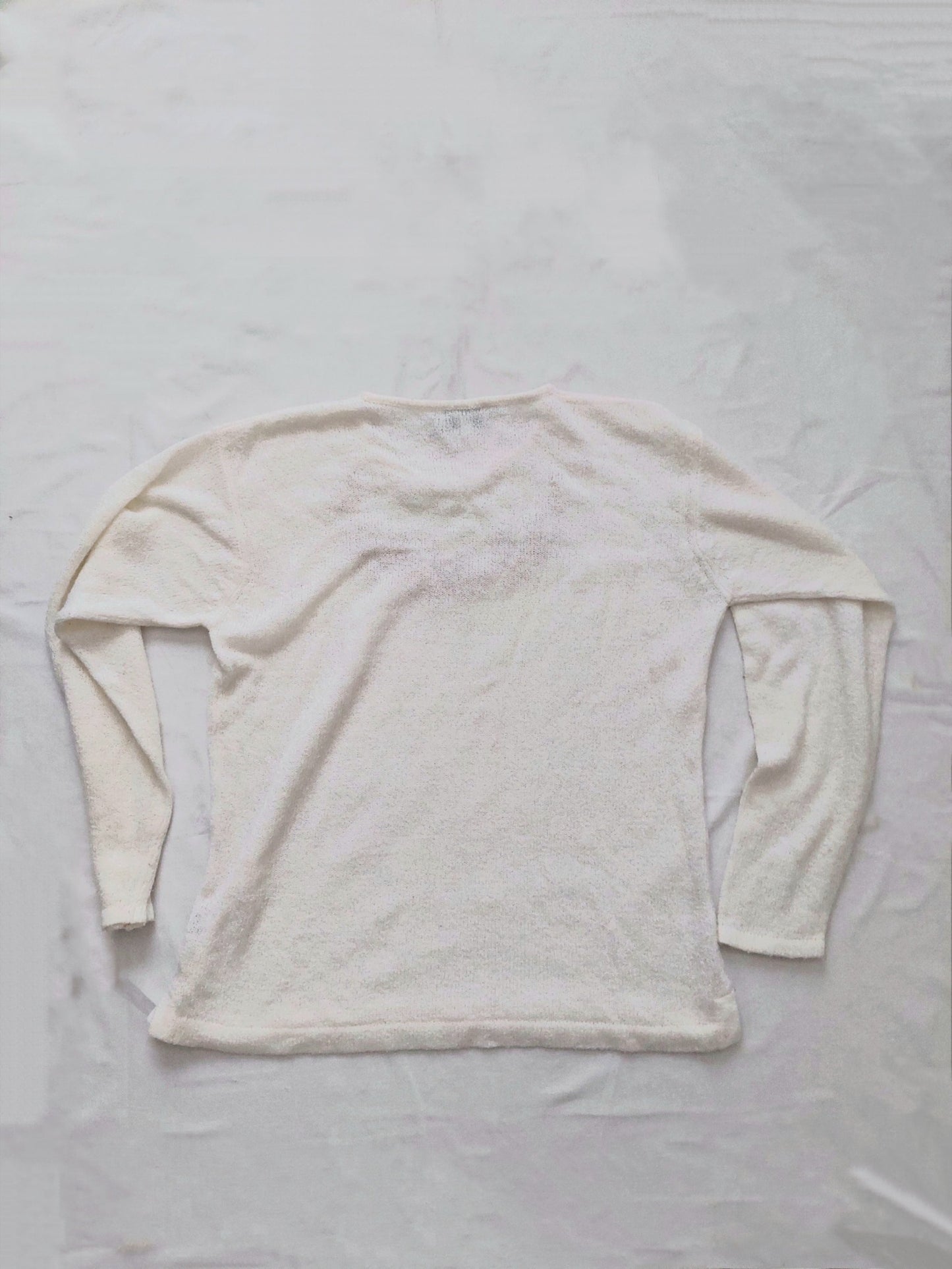 The back of the white flower sweater