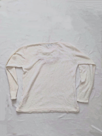 The back of the white flower sweater