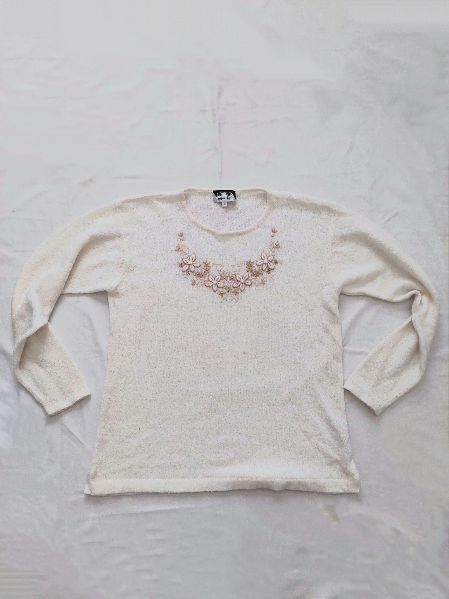 A white flower sweater