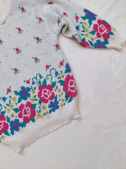 A close up of the flower sweater