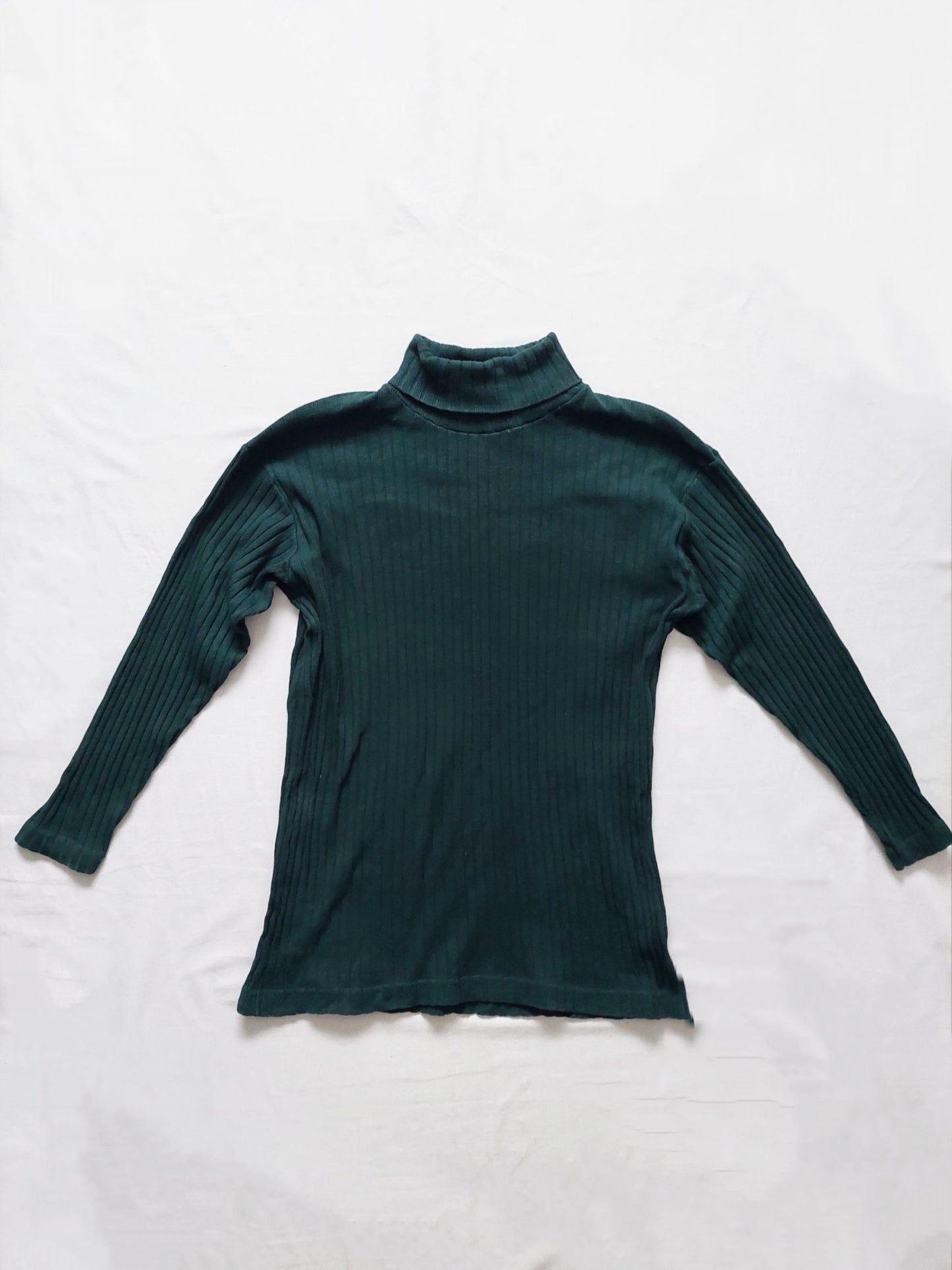 A green ribbed turtleneck