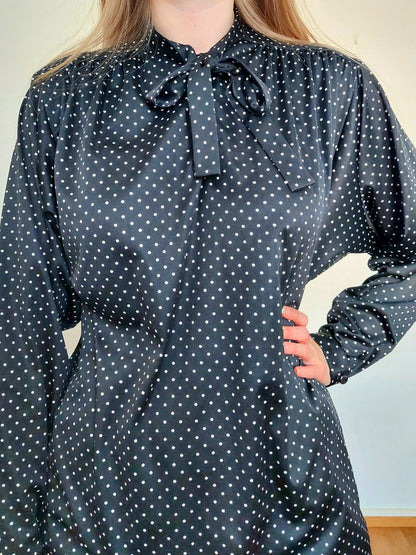 A person wearing the polkadot blouse